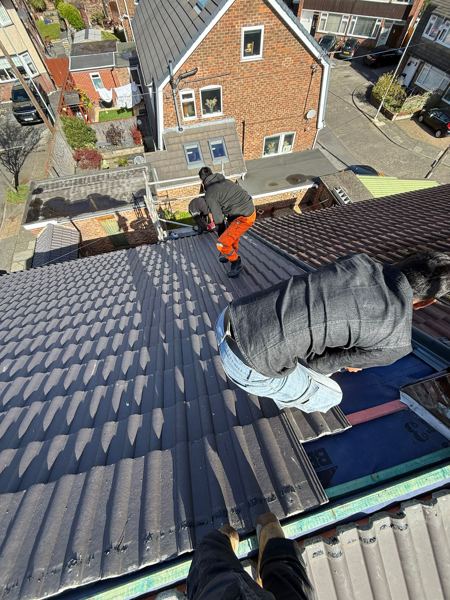 Tiling being taken down towards a lower roof on one side