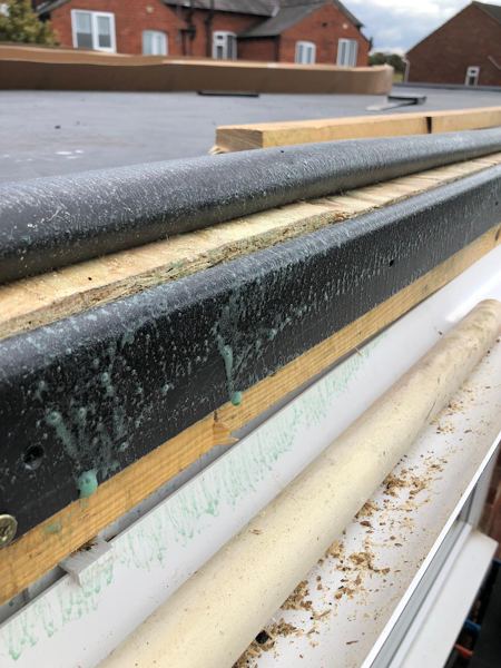 Edge detail: timber batten, black trim, new fascia and gutter